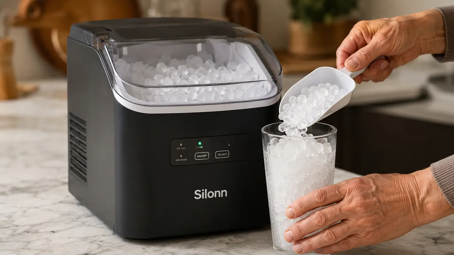Hand scooping soft nugget ice from the Silonn ice maker basket into a glass