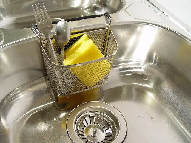 A kitchen sink sponge holder accessory 